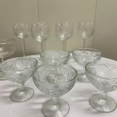 Misc. Glass Stemware | Miscellaneous stemware including: 6 etched (floral) wine glasses. 5 pressed glass sorbet glasses. Champagne flute