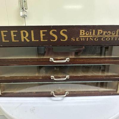 Peerless Sewing Cabinet | Vintage Peerless wooden sewing/spool cabinet with drawers. - h. 8.5 x w. 17.25 x d. 16.5 in

