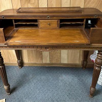 Flip Top Wood Desk | Carved wood fold top tesk with pigeon holes and central drawer, over reeded legs.

