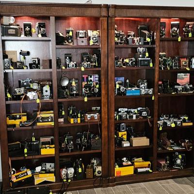 Over 250 vintage cameras about 50% still for sale