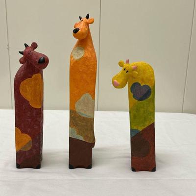 (3pc) Sheep Sculptures | Hand-painted wooden sculptures of sheep (Made in Ireland) - Tallest: 13 in. Middle: 10 in. Smallest: 9 in.

