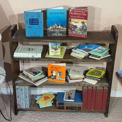Small wood bookcase with assorted books