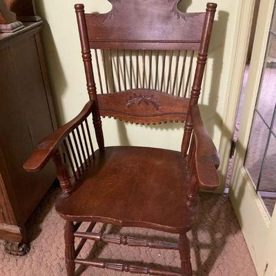 Antique pressed back arm chair