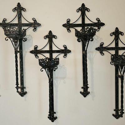 Set of 4 large metal wall candle holders.