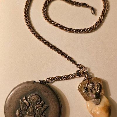 World War I (WWI) military identification locket with attached antique BPOE Elks Lodge Elks tooth gold pendant charm.