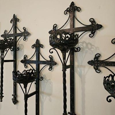 Set of 4 large metal wall candle holders.
