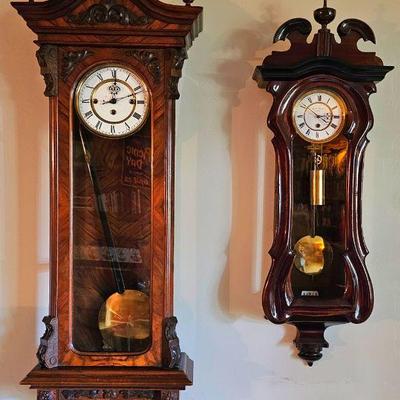 Antique regulator wall clocks.