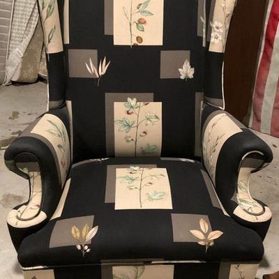 Vintage upholstered wingback chair in black botanical fabric