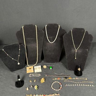 Vintage jewelry collection of necklaces bracelets, rings, and more