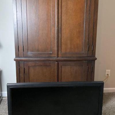 Wooden entertainment armoire with vizio 1080p hdtv
