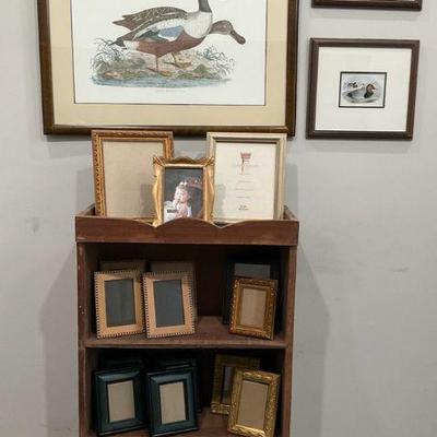 Framed duck prints with assorted picture frames and wooden shelf