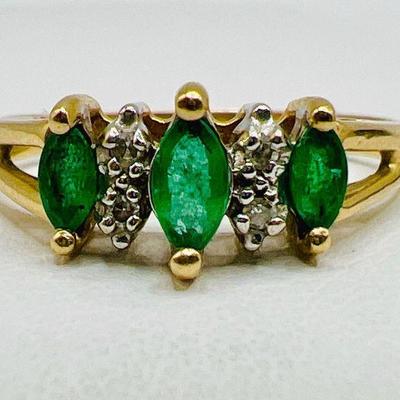 14K Gold Ring with Sparkling Green Gemstones and Diamond Accents
