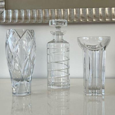 (4pc) Glass Items | Including two glass vases, a decanter with siwrled design, and a white ceramic planter. - h. 10.25 x dia. 3.5 in...
