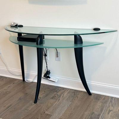 Glass Demilune Table | Modern glass side table with medial shelf, over three splayed legs; n.b. electronics not included. - h. 28.75 x l....