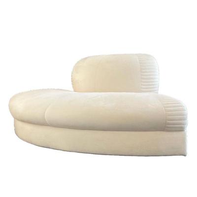 CURVED LOVESEAT | Love seat or corner lounge chair in creme colored ultra suede upholstery, pairs with the sectional sofa (lot #5) or can...