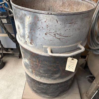 #1166 • 55 Gal Scrap Metal Drum with Dolly
