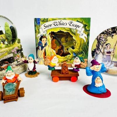 Lot #8 Vintage Disney Snow White & Seven Dwarfs Musical Snow Globe ("Hi Ho, Hi Ho"), Book, Button, and Figurines
