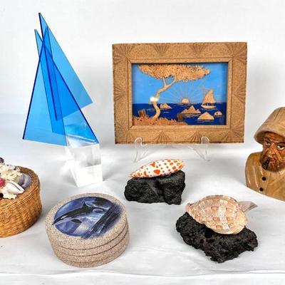 Lot #83 Carved Wood Fisherman Bust, Abstract Sail Boat, Seashells, Cork Art, Whale Coasters
