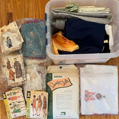 Plastic Tote With Assorted Vintage Sewing Patterns And Material Cutters