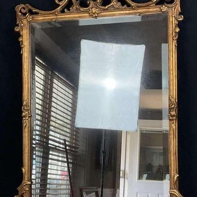 Gilded rectangular wall mirror with decorative frame