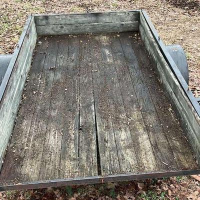 Utility trailer with wood deck and side rails