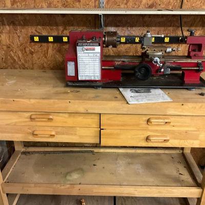 Precision mini lathe on wooden workbench