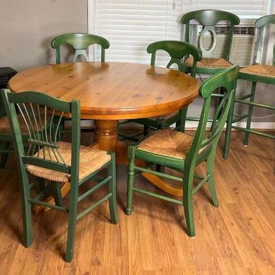 Rustic round dining table with 6 matching chairs plus one more