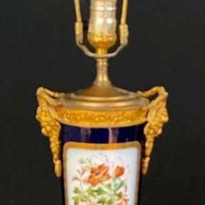 Ornate porcelain and brass table lamp with floral design