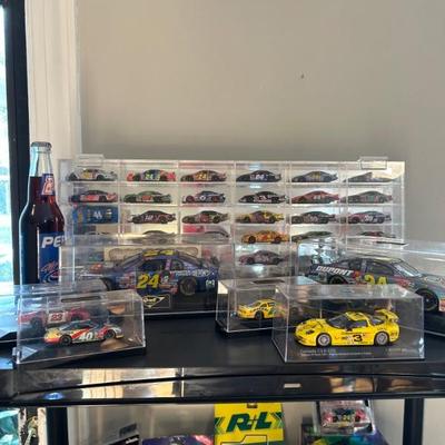 TONS of NASCAR cars, memorabilia, and merch! 