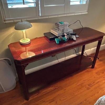 Asian style console/foyer/sofa table.. measures 54” x 16” x 27”. Offered at $150. 