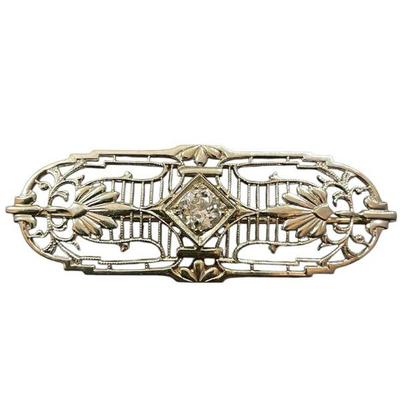 KIHE301 Antique 14k White Gold & Diamond Filigree Brooch	Very old pin with incredible rare safety catch. Large diamond center that...