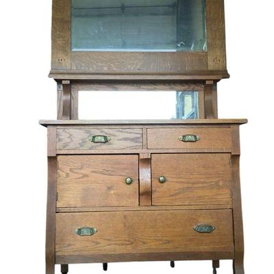 POES621 Wooden Dresser And Hanging Mirror	This lot has a large mirror(H29XL43XW6) and a dresser with mirror on wheels(H49.5XL39.5XW19.25).
