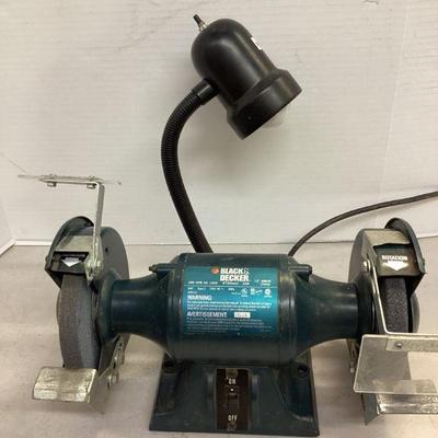 BRDA108 Black & Decker 6” Bench Grinder	Tested & in good running condition. Plastic cover over one blade has broken off. 
