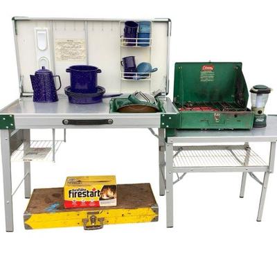 ANMA628 Coleman Kitchen And Cookware Assortment	This lot includes a Handy foldable table and chairs set, Coleman 425E dual flame grill,...