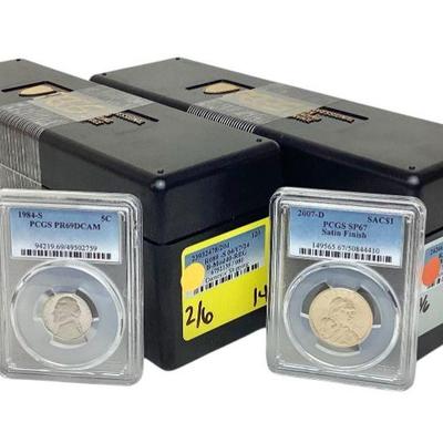 TN116 Two Boxes Of PGCS Slabbed Coins	One box misc US coins, (1 missing) the 2nd box is Sacagawea dollar coins.
