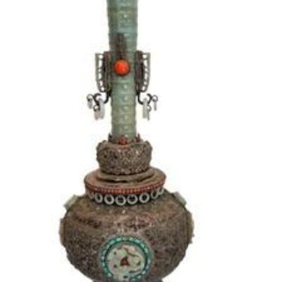 Vintage Chinese Mongolian Vase 

Stunning and intricate design featuring natural stones and carved jade or serpentine accented with...