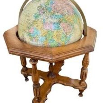 Vintage Replogle Heirloom Illuminated Globe and Wood Stand.

There is a small damaged spot that can be seen in the photos.

Measures 38”...