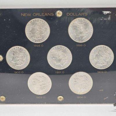 #1510 • (7) 1898-1904 Morgan Silver Dollars
