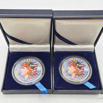 #1418 • (2) 1921 Painted Morgan Silver Dollars
