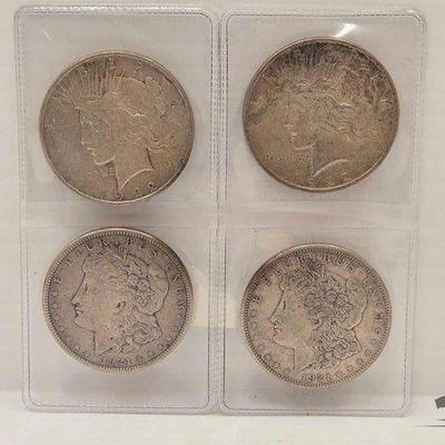 #1664 • (4) Morgan Silver Dollars

