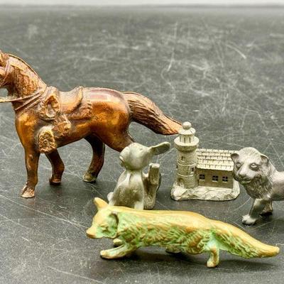 (5) Metal Animal Figurines
Dog is stamped Spoon Pewter
Lion is stamped pewter
Lighthouse is stamped Kirk pewter
Fox appears to be made of...
