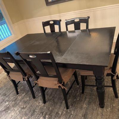 Expandable Dark Wooden Dining Table w/ 2 Leaves & 5 Weave Chairs	