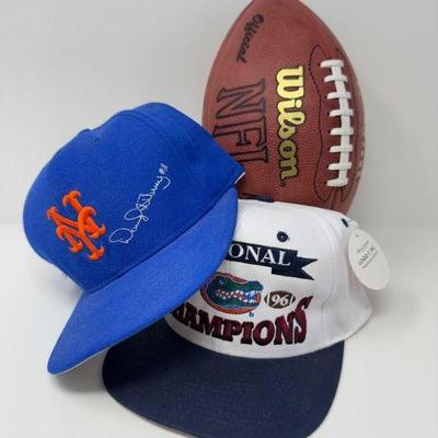 Autographed Peyton Manning NFL Football & 2 Assorted MLB Caps	