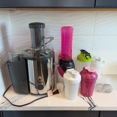 Lot #30 - Kitchen Appliances Lot - Bella Juicer, Oster Blender, and Multiple Shakers.