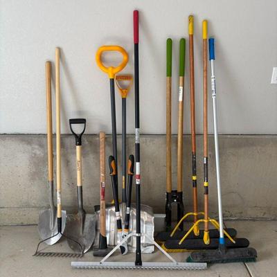 Lot #206 - Landscape Tool Lot - Assorted Brooms, Rakes, Shovels, Post Digger, Loppers, Sledgehammer & More.