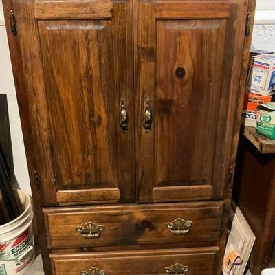Rustic wooden armoire with drawers