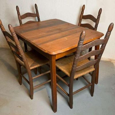 Solid wood kitchen table with four chairs with rush seats