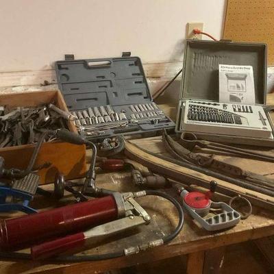 Large assortment of hand tools including vintage drill bit set