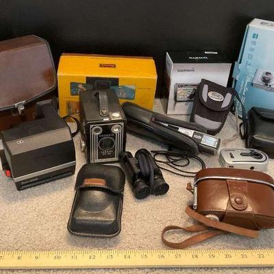 Vintage and modern camera collection with binoculars