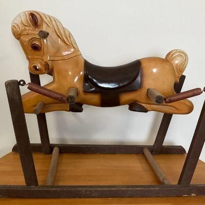 Vintage rocking horse on springs